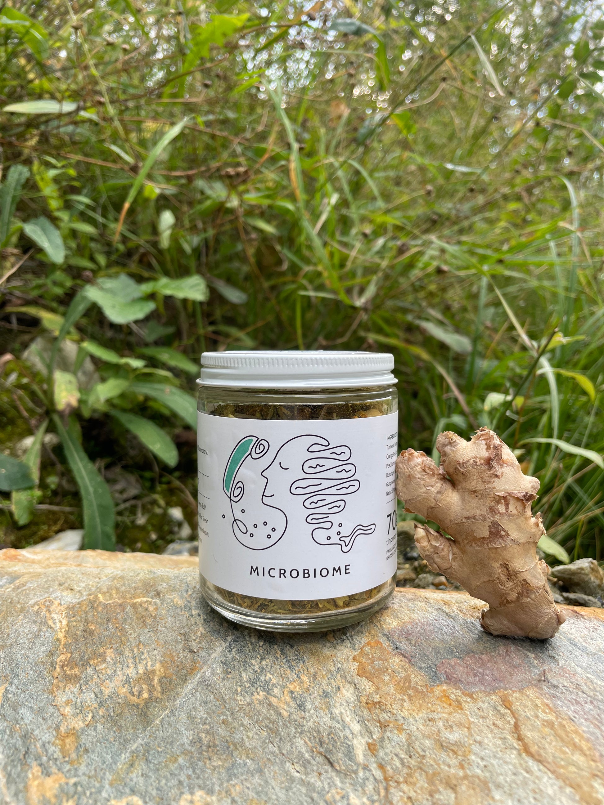 A jar of Microbiome Tea from Tin Poppy Retreat